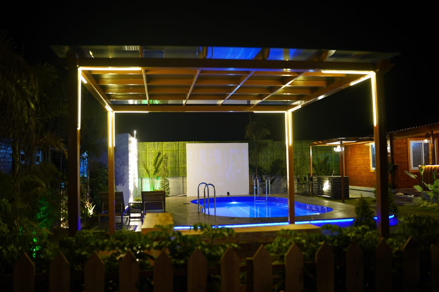 Private pool with projector setup at La Cabana Farm Stay