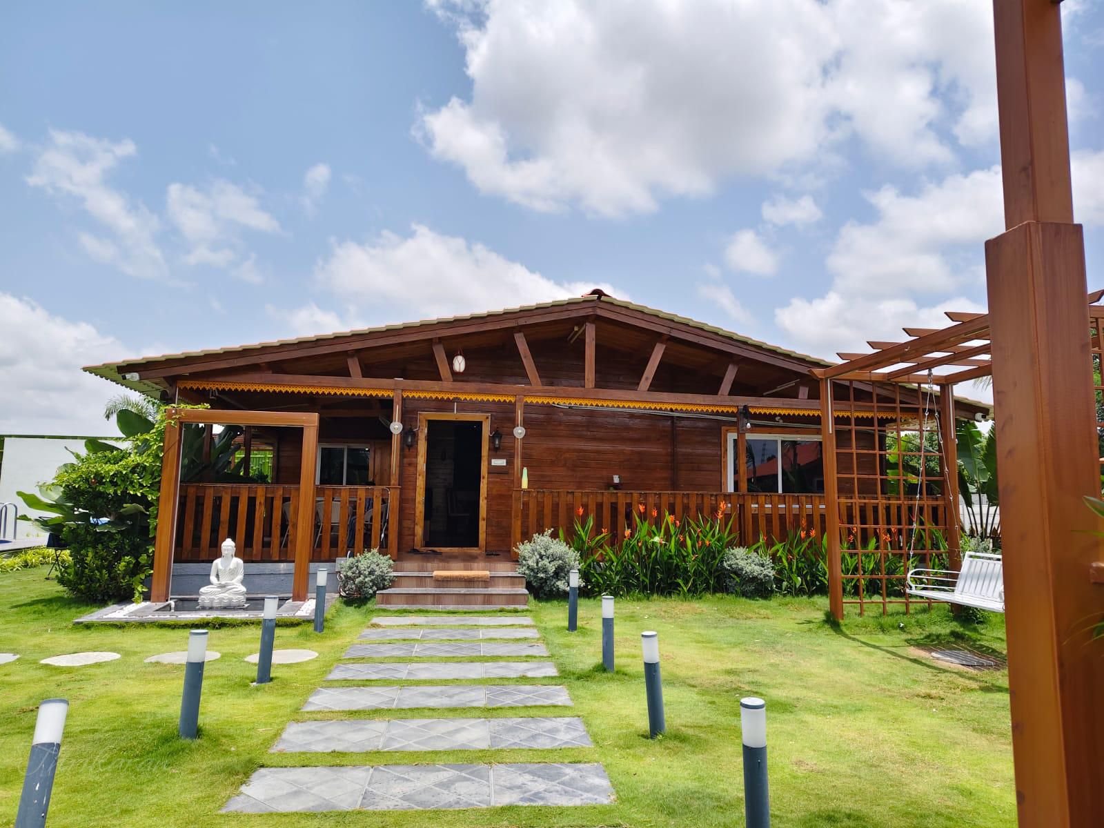 Daytime exterior view of La Cabana Farm Stay in Moinabad